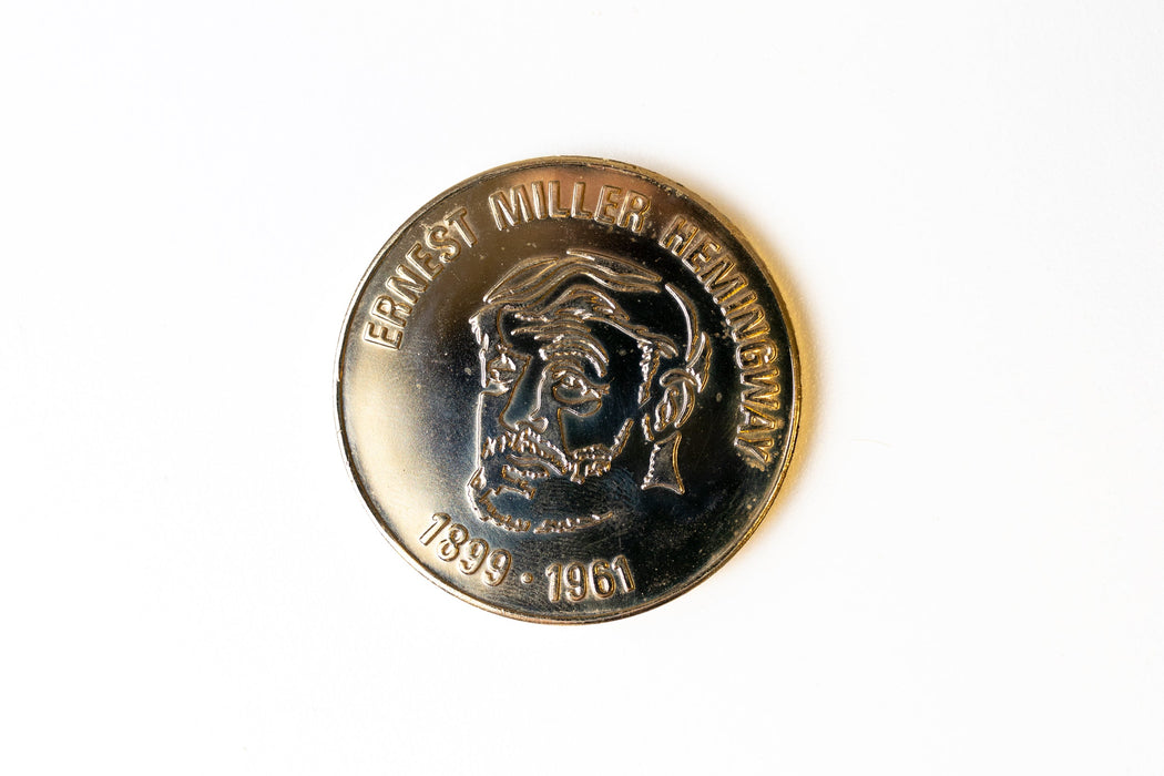 Two rare Cuban coins, one likely signed by Fidel Castro